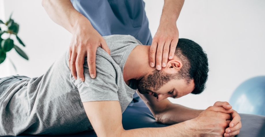 Man receiving neck and shoulder massage
