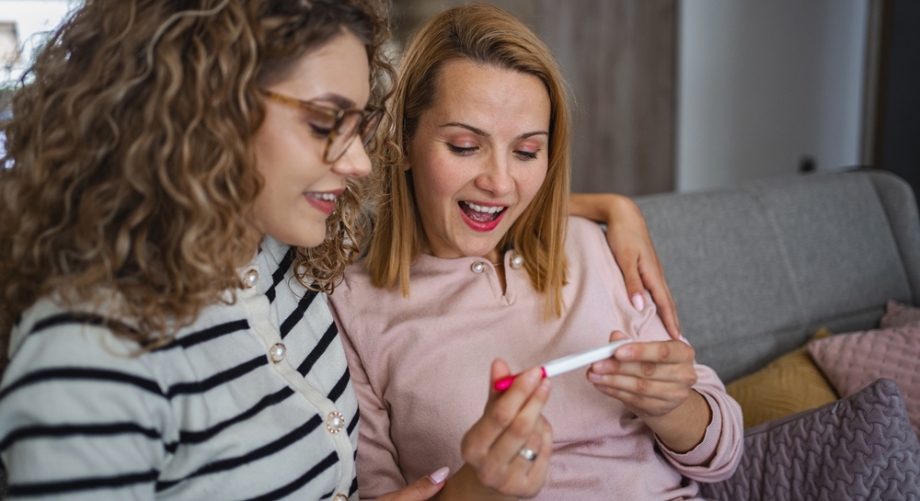 Doula and client holding pregnancy test