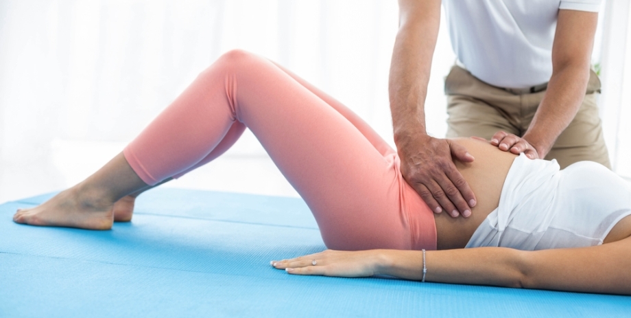 Pregnant woman receiving Abdominal Massage