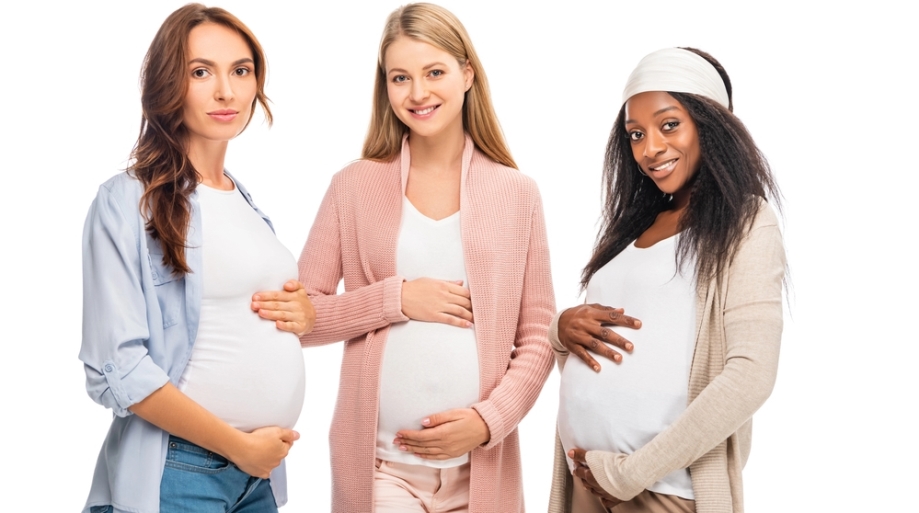 Three pregnant woman of different race and culture