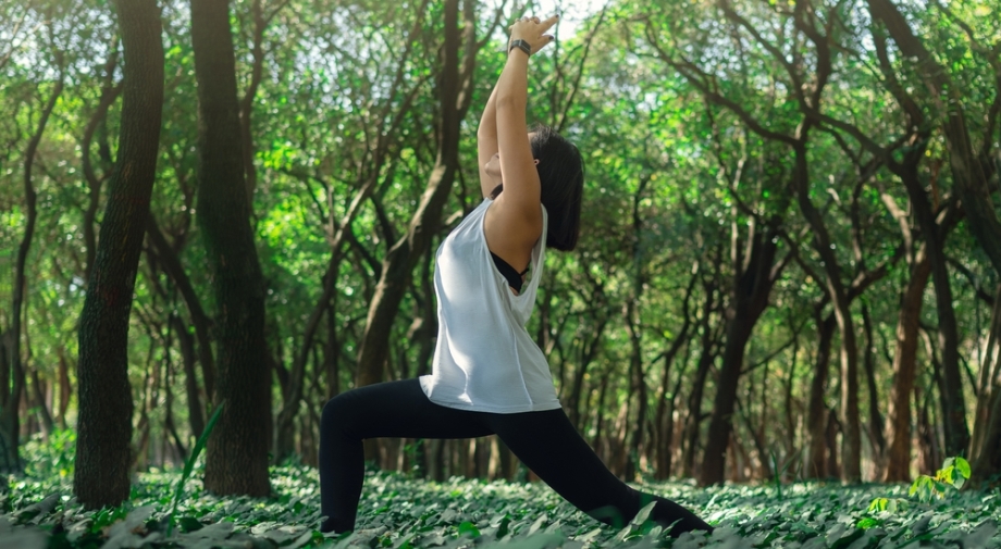 Woman exercising in the forest