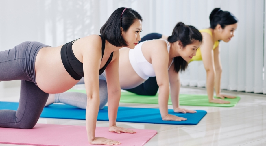 Pregnant women doing yoga