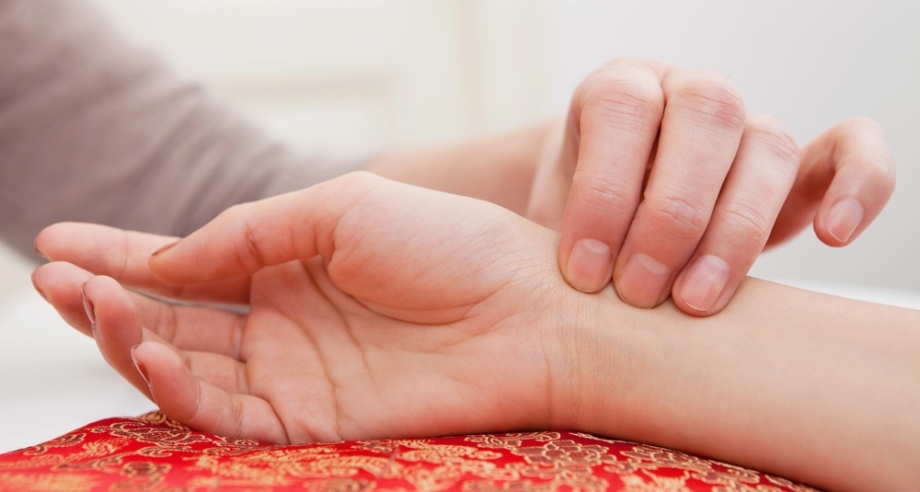 Doctor and patientdoing pulse diagnosis