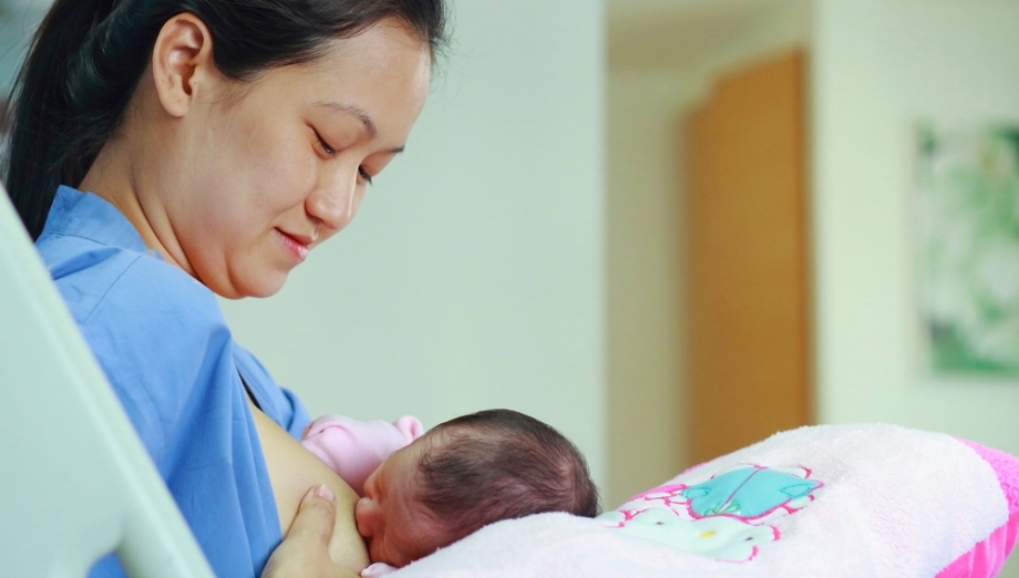 Thai woman breastfeeding her child