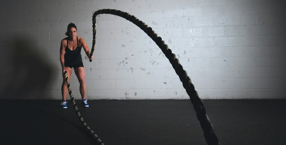 Woman holding brown rope