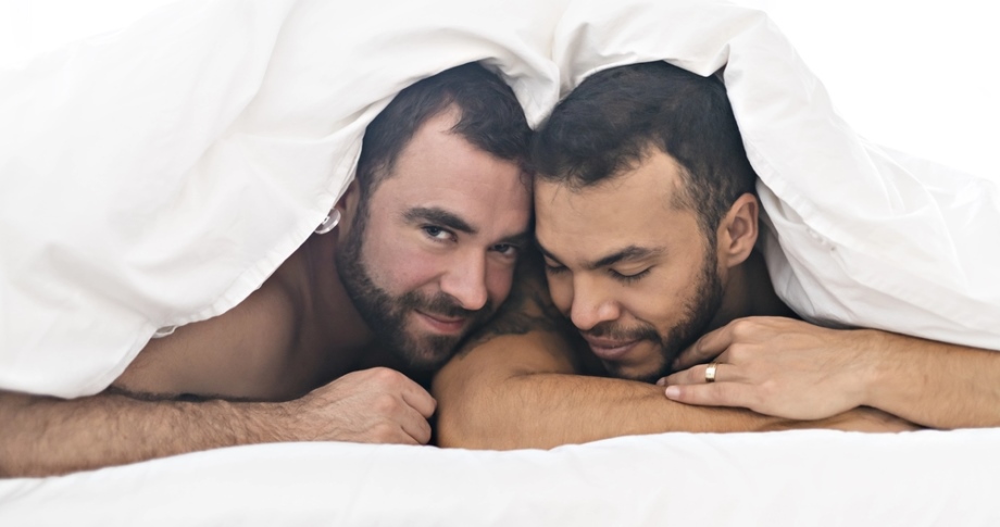 Two gay men in bed