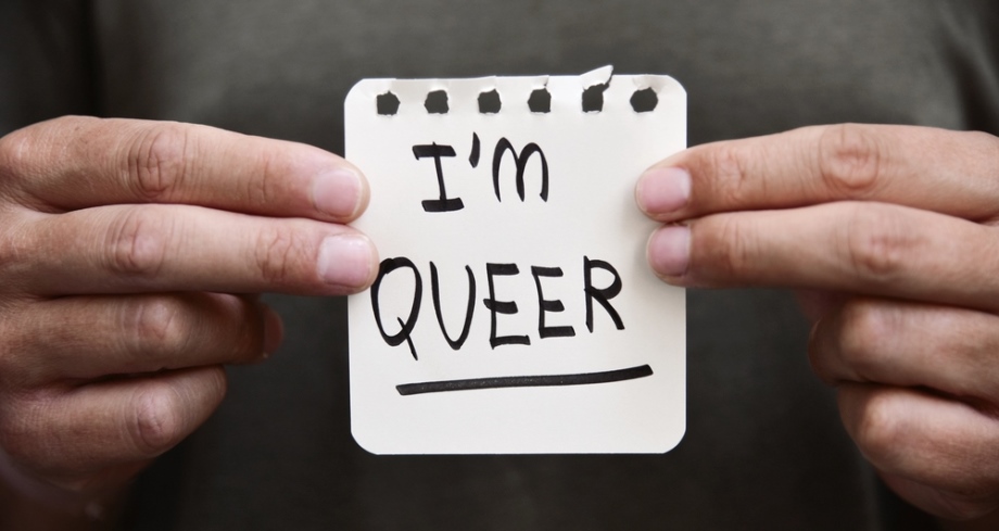 I am Queer sign in hands of queer person