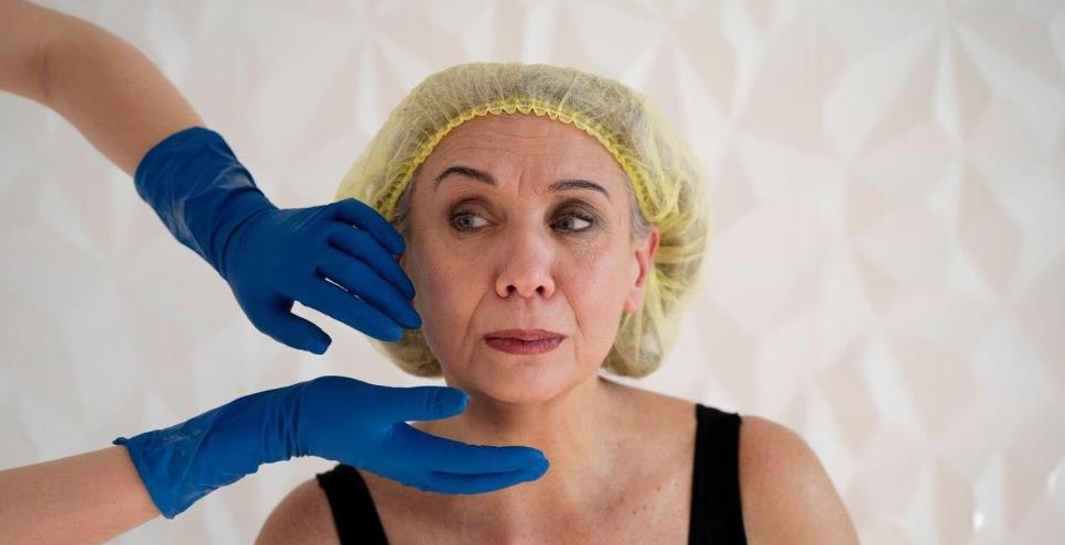 Senior woman wearing surgical cap