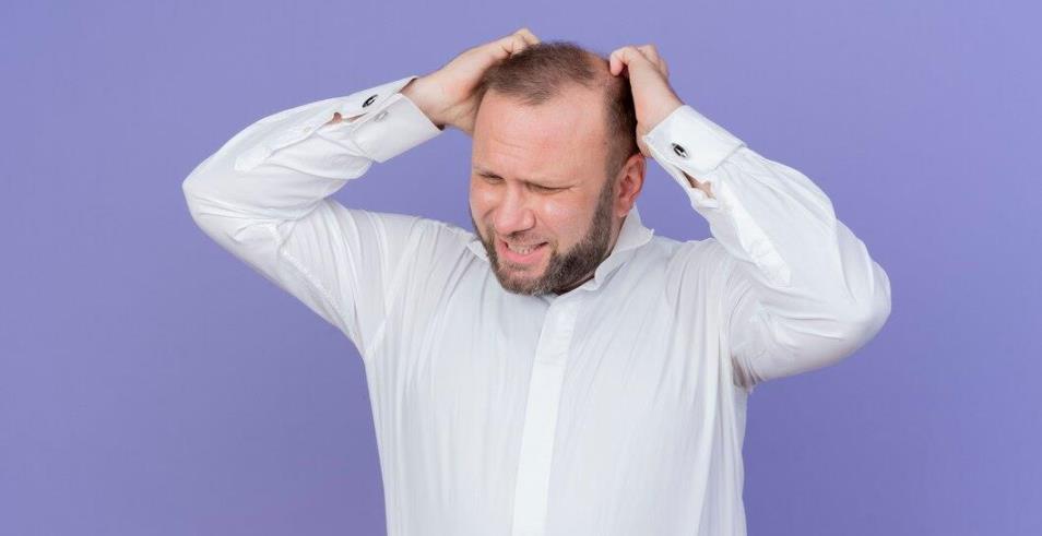 Man frustrated with hair loss